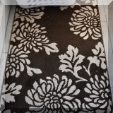 D20. Brown and white throw rug. 